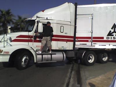 My husband helping another trucker get unstuck from the middle of A1A in Florida. 