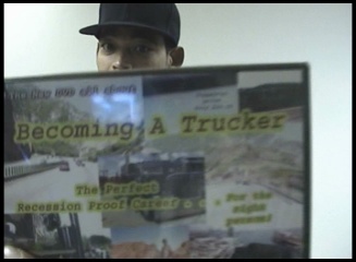 me holding the becoming a trucker dvd