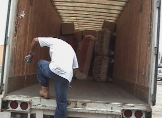 Paid to exercise. The crazy trucker unloading furniture.
