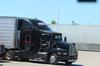 Trucker driving across truck stop